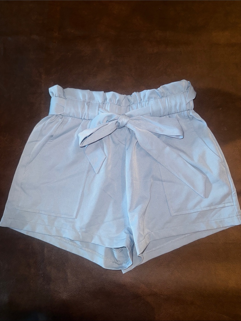 New without tags. Never worn. Windsor Light Blue High-Waist Paperbag Tie Shorts